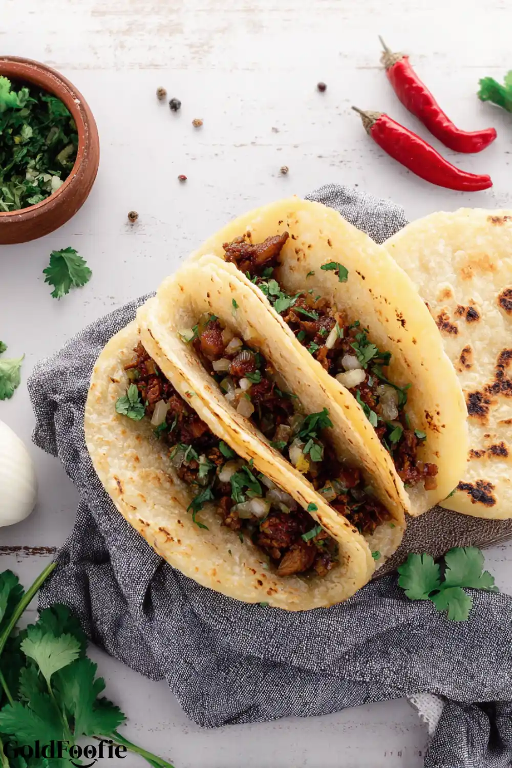 Keto Beef Tacos on Homemade Corn-Style Tortillas corn tortillas low carb filled with beef and onions on a rustic table