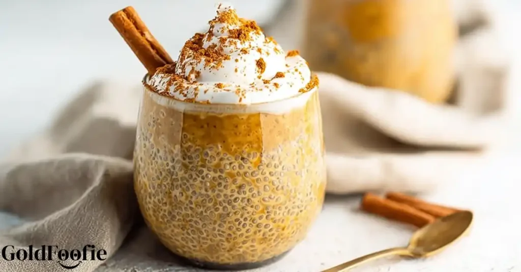 Pumpkin chia pudding topped with whipped cream and cinnamon stick