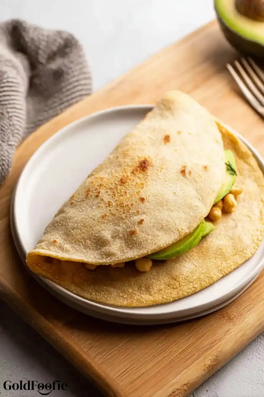 Stuffed Oat Tortilla Wrap Folded oat tortilla filled with avocado and chickpeas