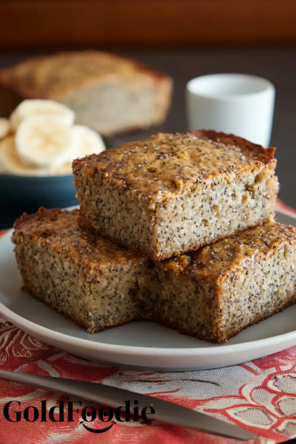Banana Chia Seed Cake with Sliced Bananas Banana chia seed cake with fresh banana slices and coffee