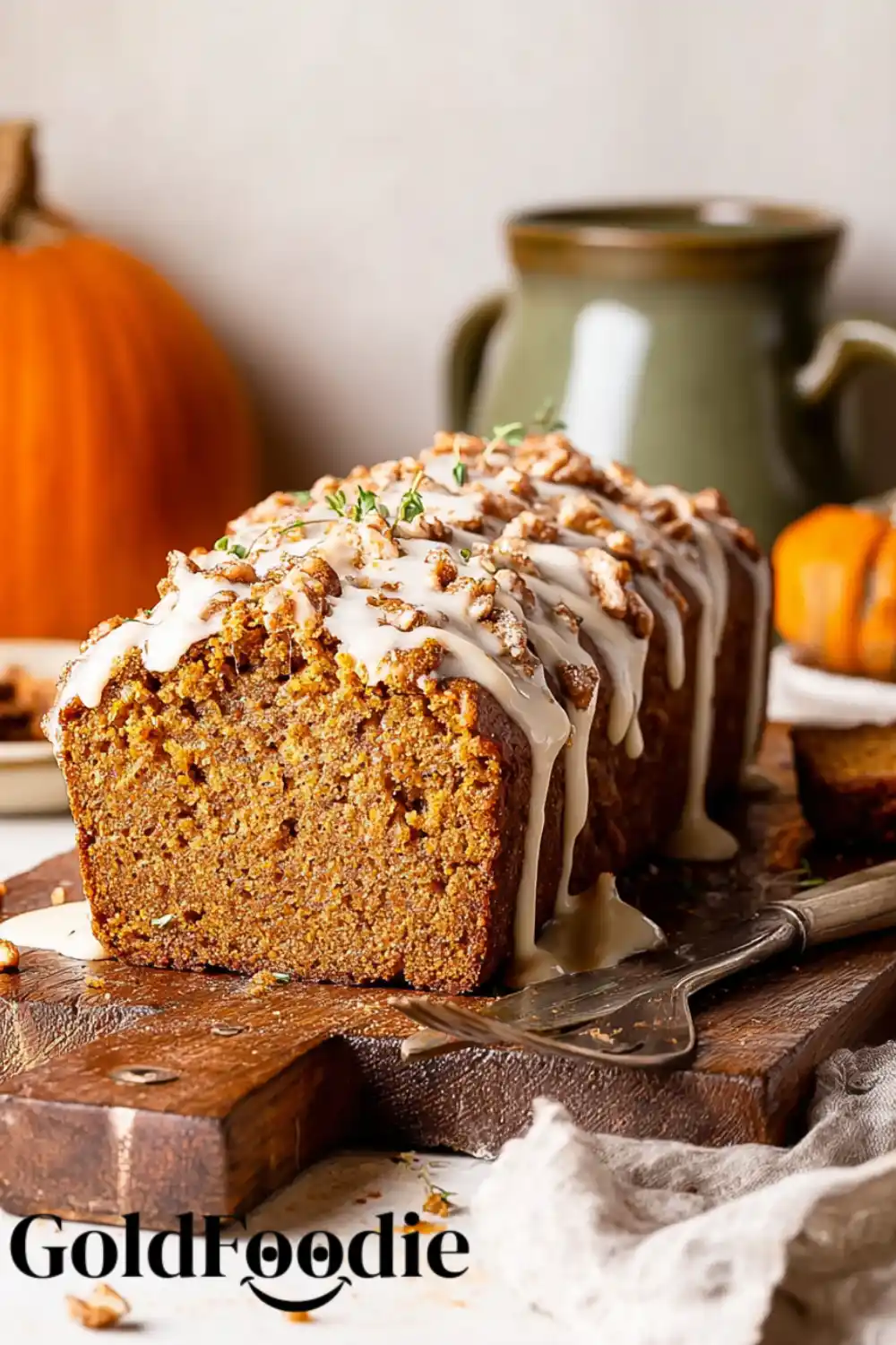 Easy Vegan Pumpkin Loaf Side view of a glazed pumpkin loaf.