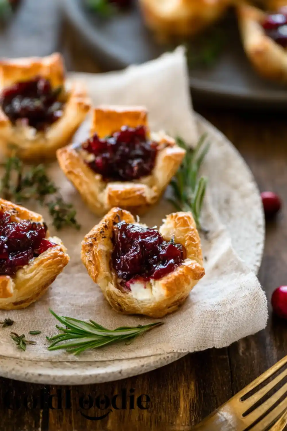 Cranberry Brie Bites on a White Linen Napkin Cranberry Brie Bites