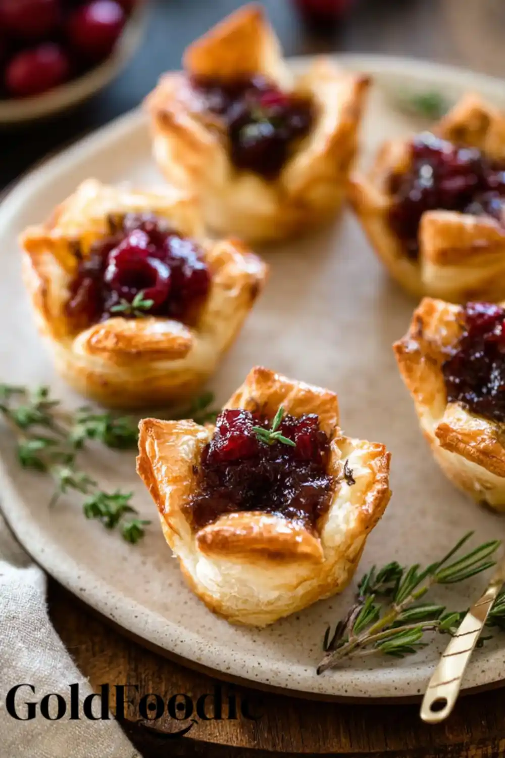 Festive Cranberry Brie Bites with Thyme Garnish Festive Cranberry Brie Bites