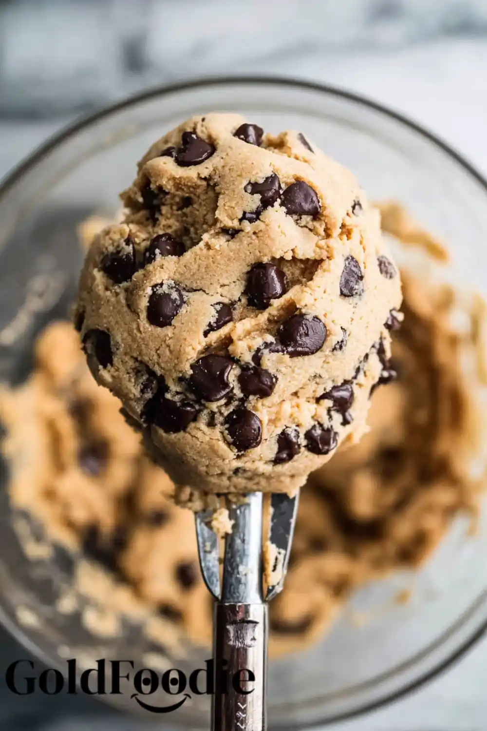 A scoop of raw chocolate chip cookies dough