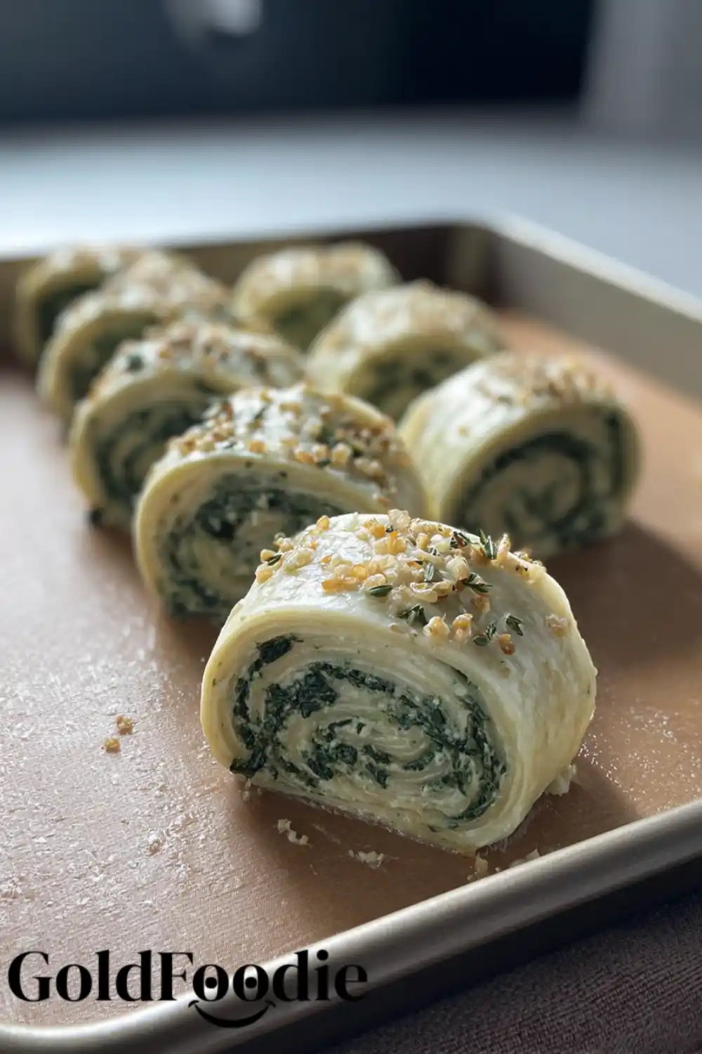 Raw, sliced spinach and ricotta salatini recipes rolls arranged