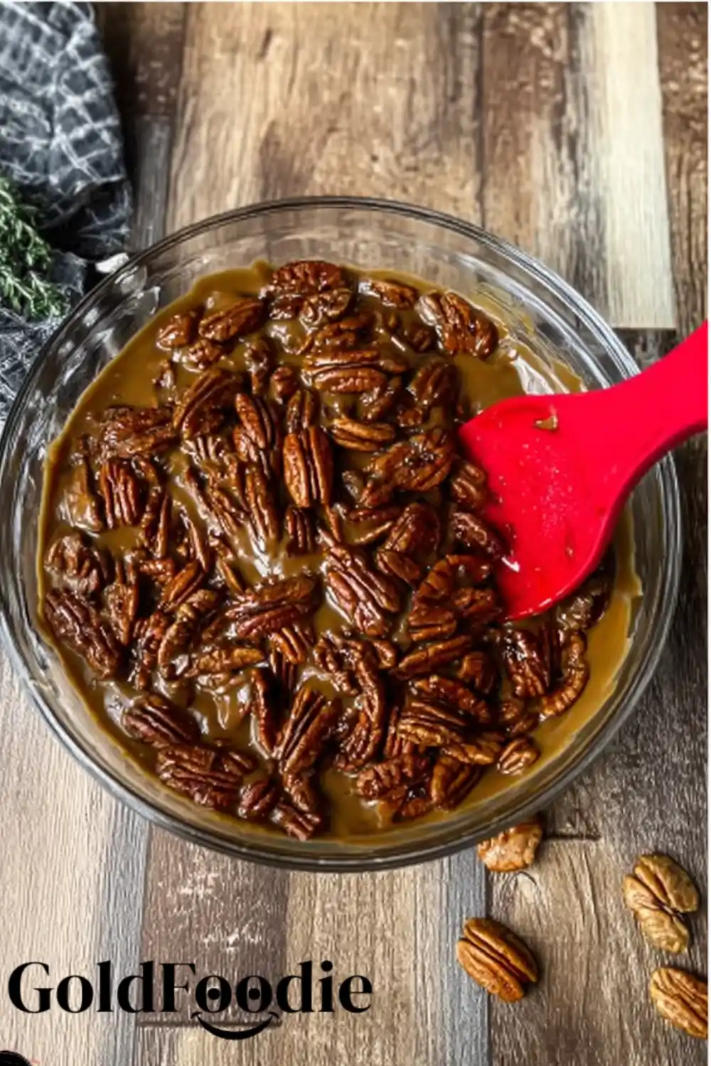 coating-pecans-in-gingersnap-mixture coated gingersnap pecans mexing