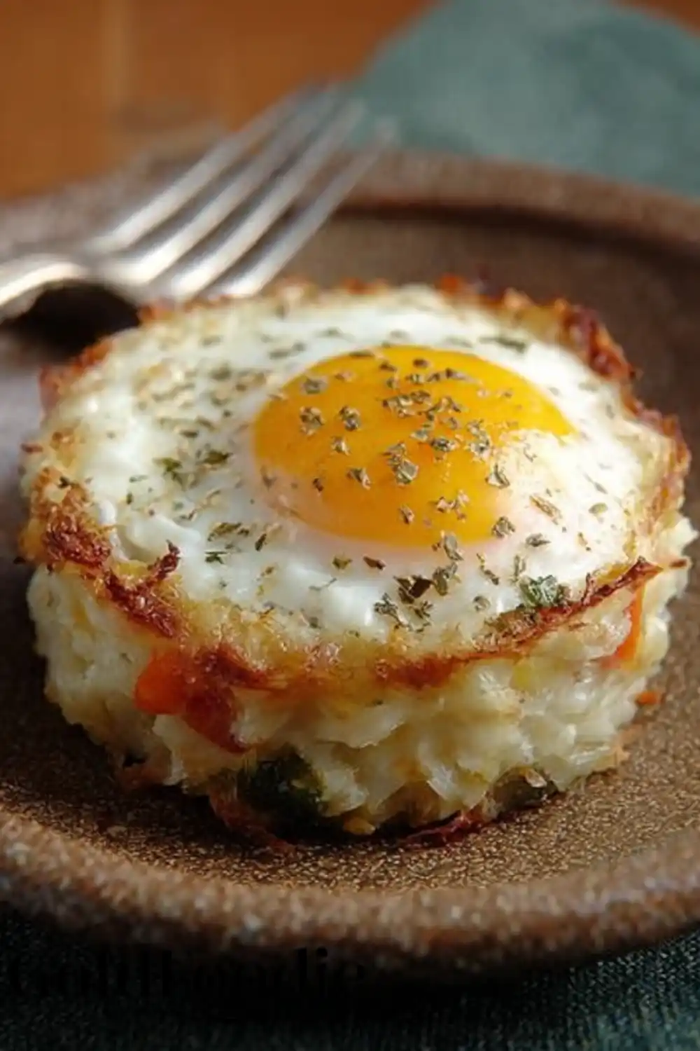Close-up of Baked Tater Tot Egg Nest Baked Eggs Napoleon Breakfast