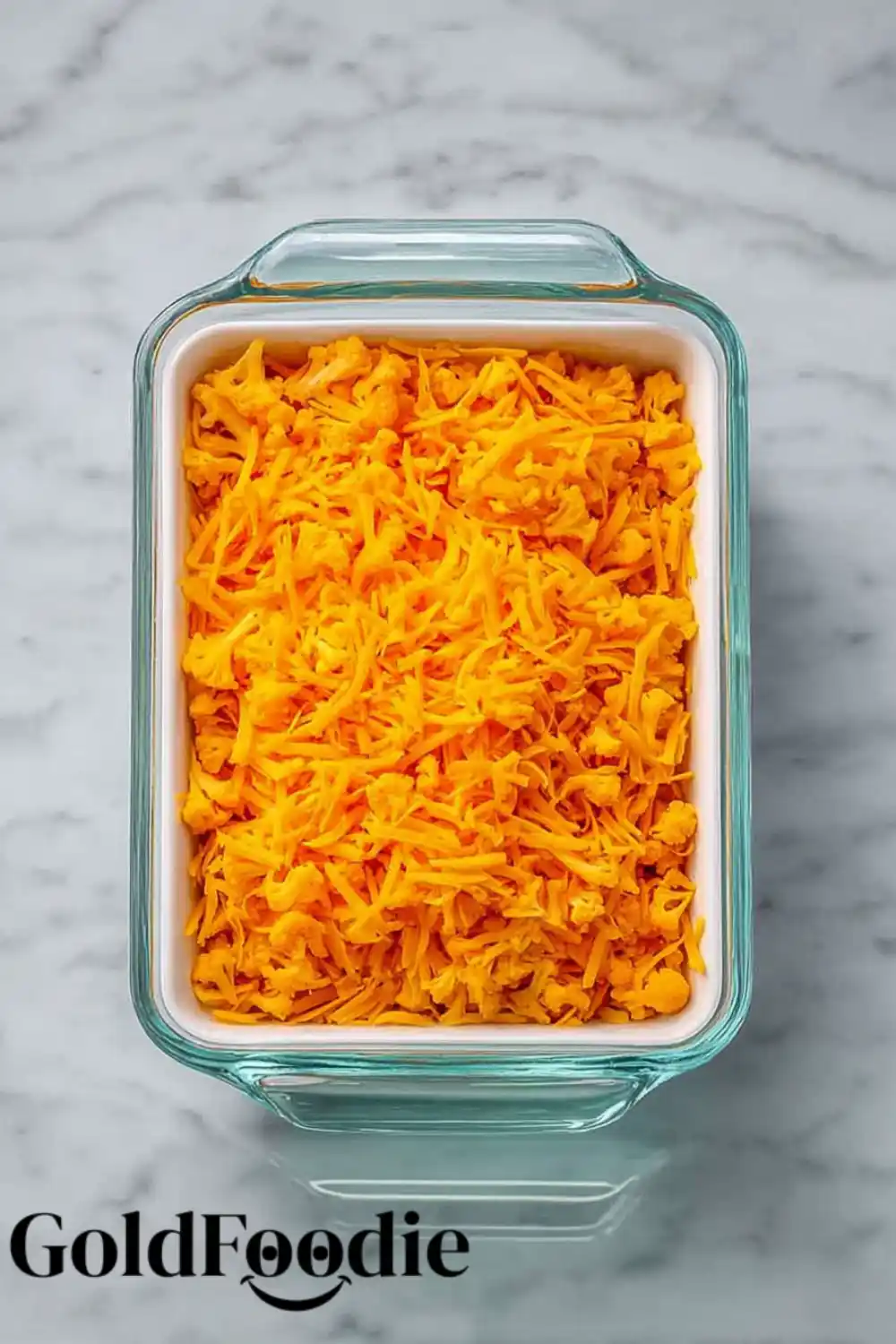 Layering Cheddar Cheese on Buffalo Chicken Cauliflower Casserole Layering Cheddar Cheese on Buffalo Chicken Cauliflower Casserole