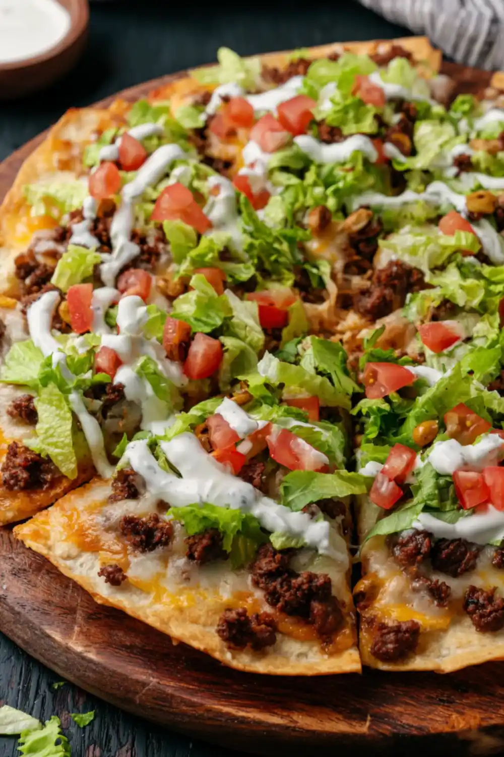 Sliced Cool Ranch Taco Pizza on Wood Board Sliced Cool Ranch Taco Pizza