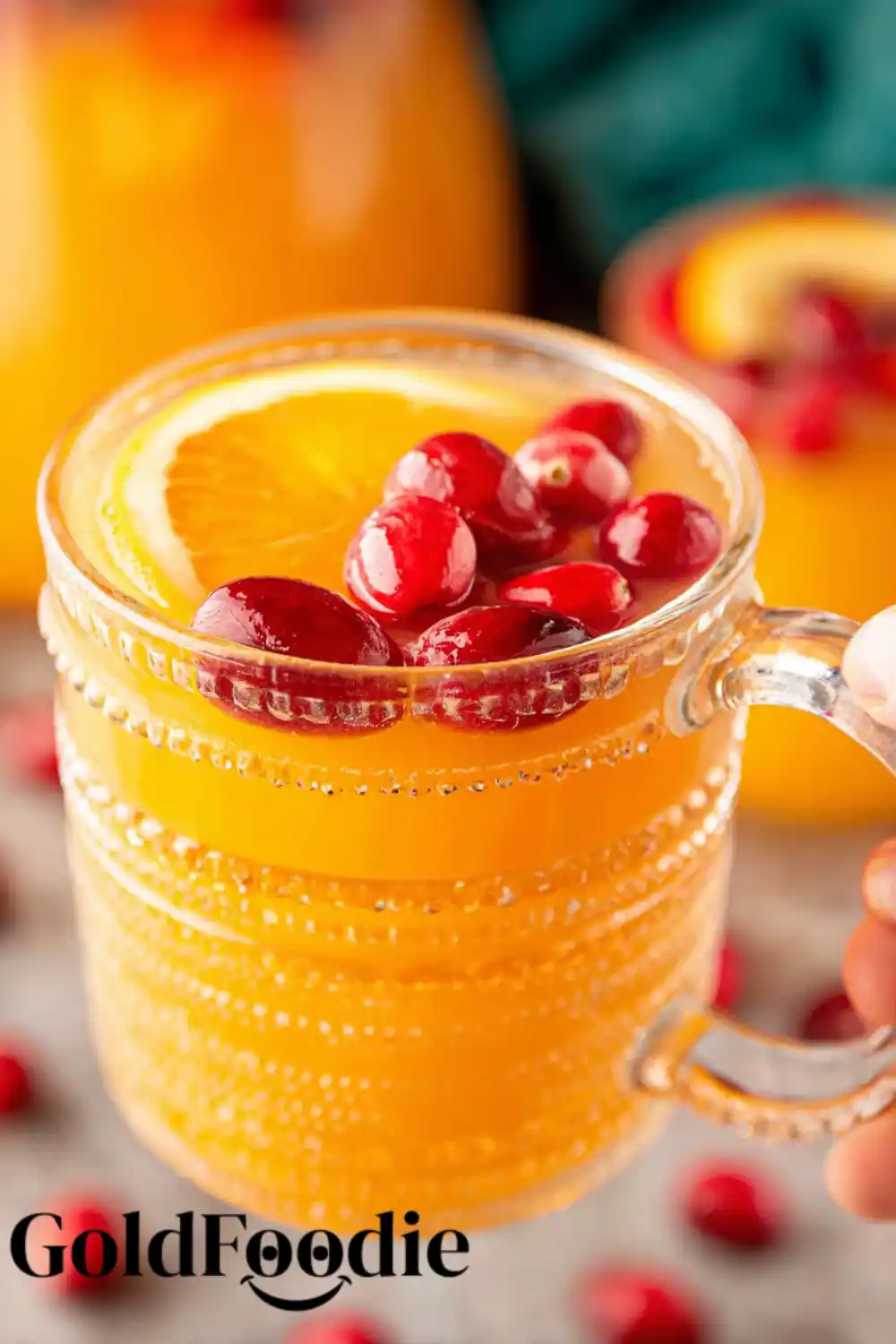 Hand Holding Mug of Festive Christmas Morning Punch