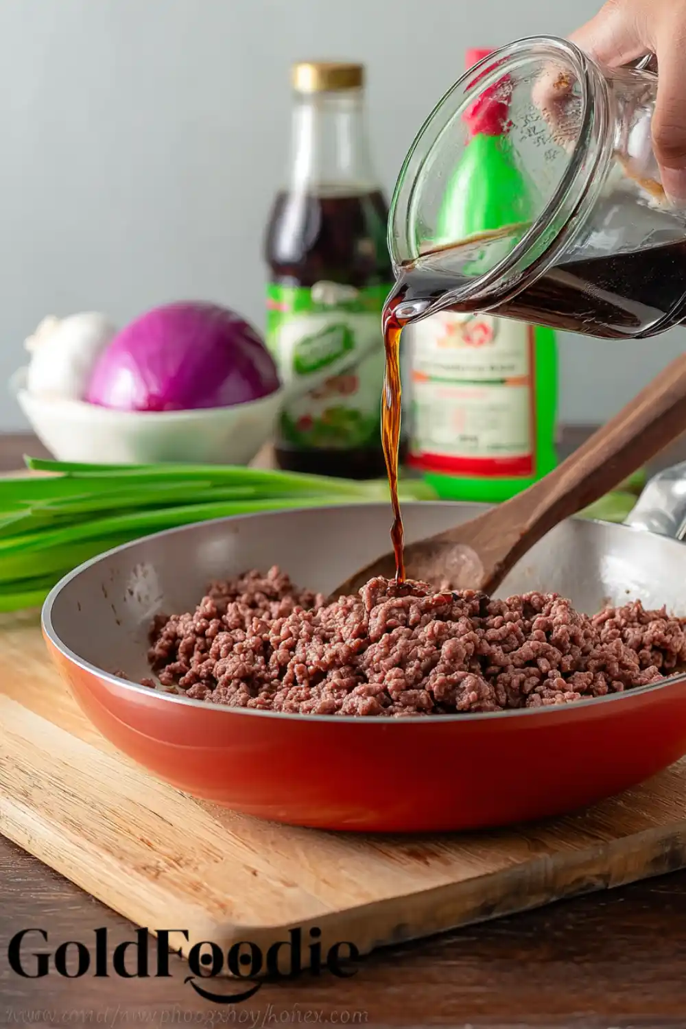 Pouring Sauce into Ground Beef