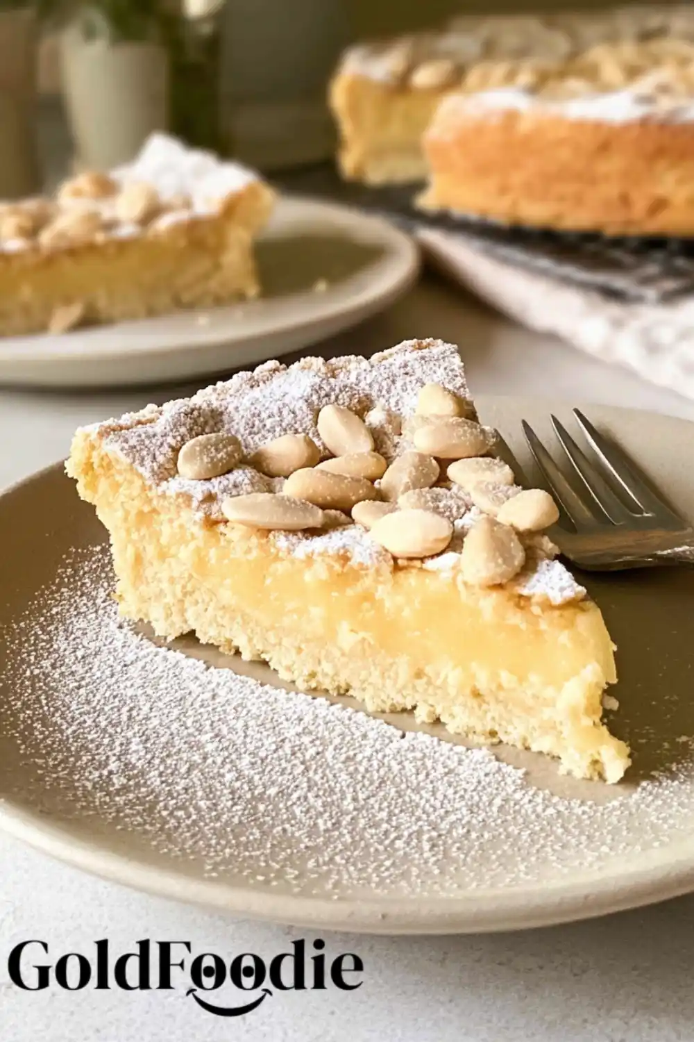 Slice of Torta della Nonna with Blanched Almonds Slice of Torta della Nonna