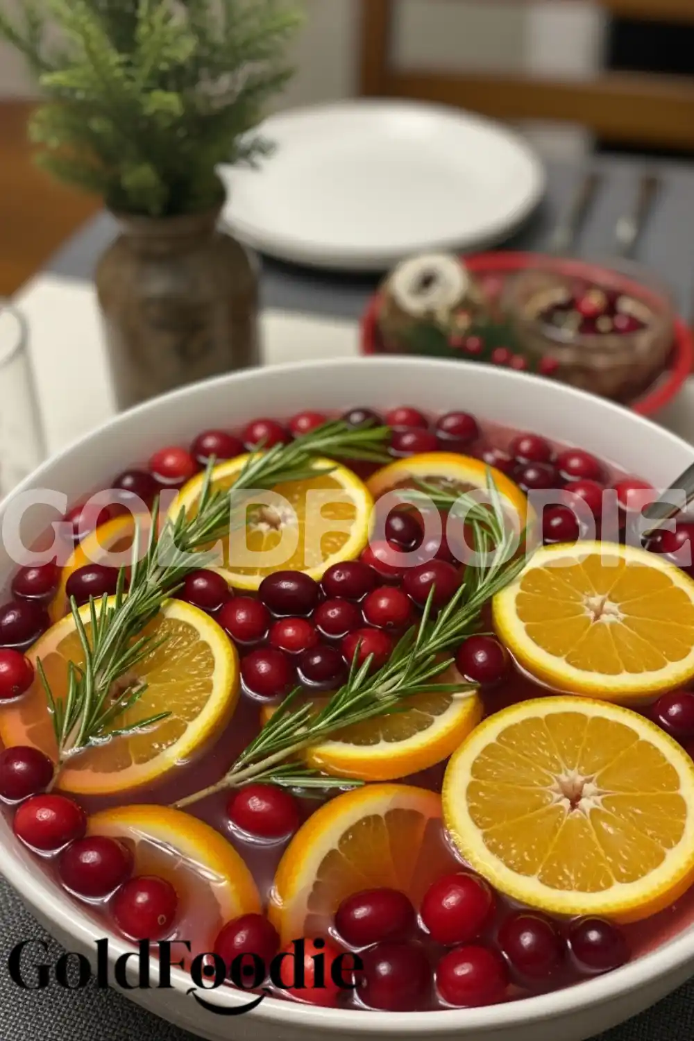 Festive Holiday Punch with Orange Slices and Rosemary