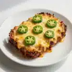 Chili Relleno Casserole 2 A freshly baked chili relleno casserole served in a glass dish.