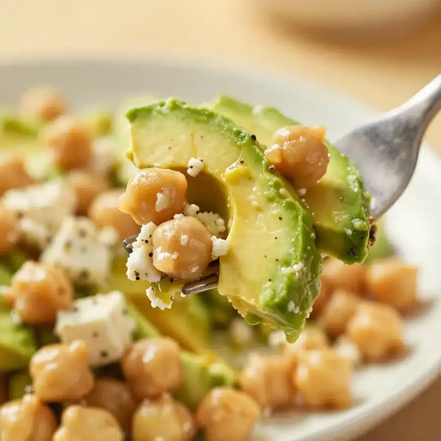 Chickpea Feta Avocado Salad 5 A vibrant bowl of chickpea, feta, and avocado salad with fresh herbs and vegetables.