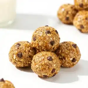 A plate of homemade energy balls made from nuts and dried fruits