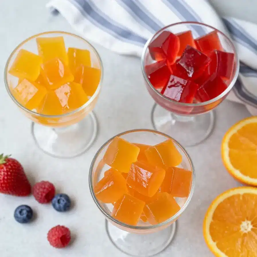 Healthy Homemade Jello 5 A bowl of vibrant, colorful homemade jello made with fresh fruit slices.