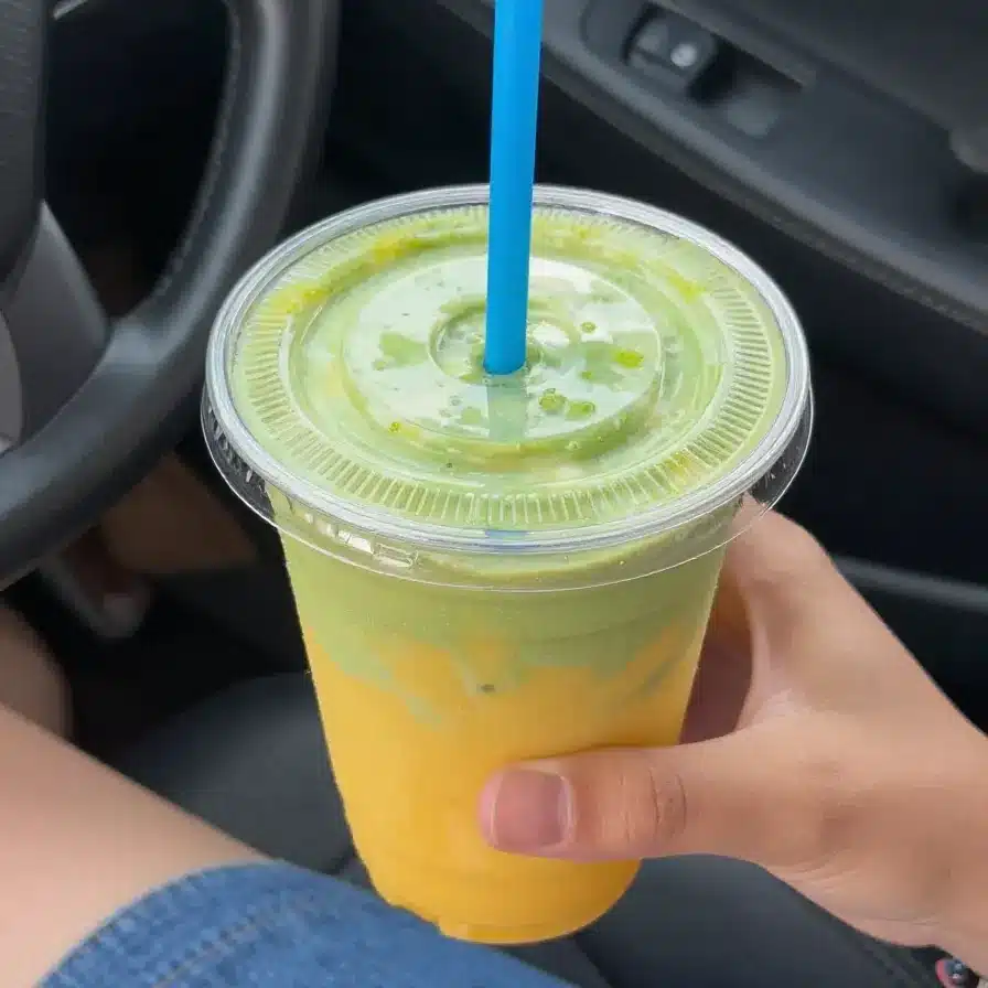 Energy Drink Recipe 5 A vibrant energy drink made with fresh fruits and herbs in a glass