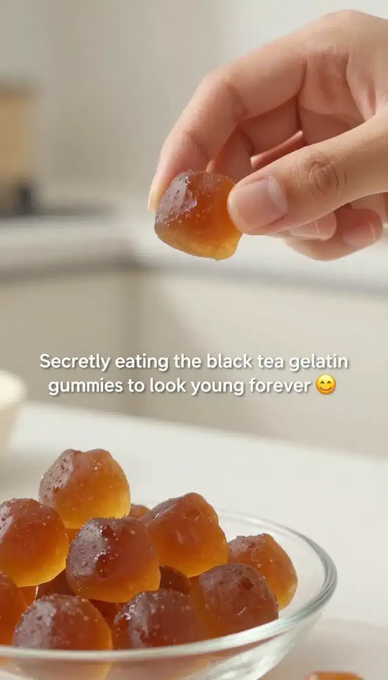 Making the Viral Tea Gelatin Collagen Gummy to Look Young Forever 9 Close-up of homemade tea gelatin collagen gummies shaped like small cubes on a white plate.