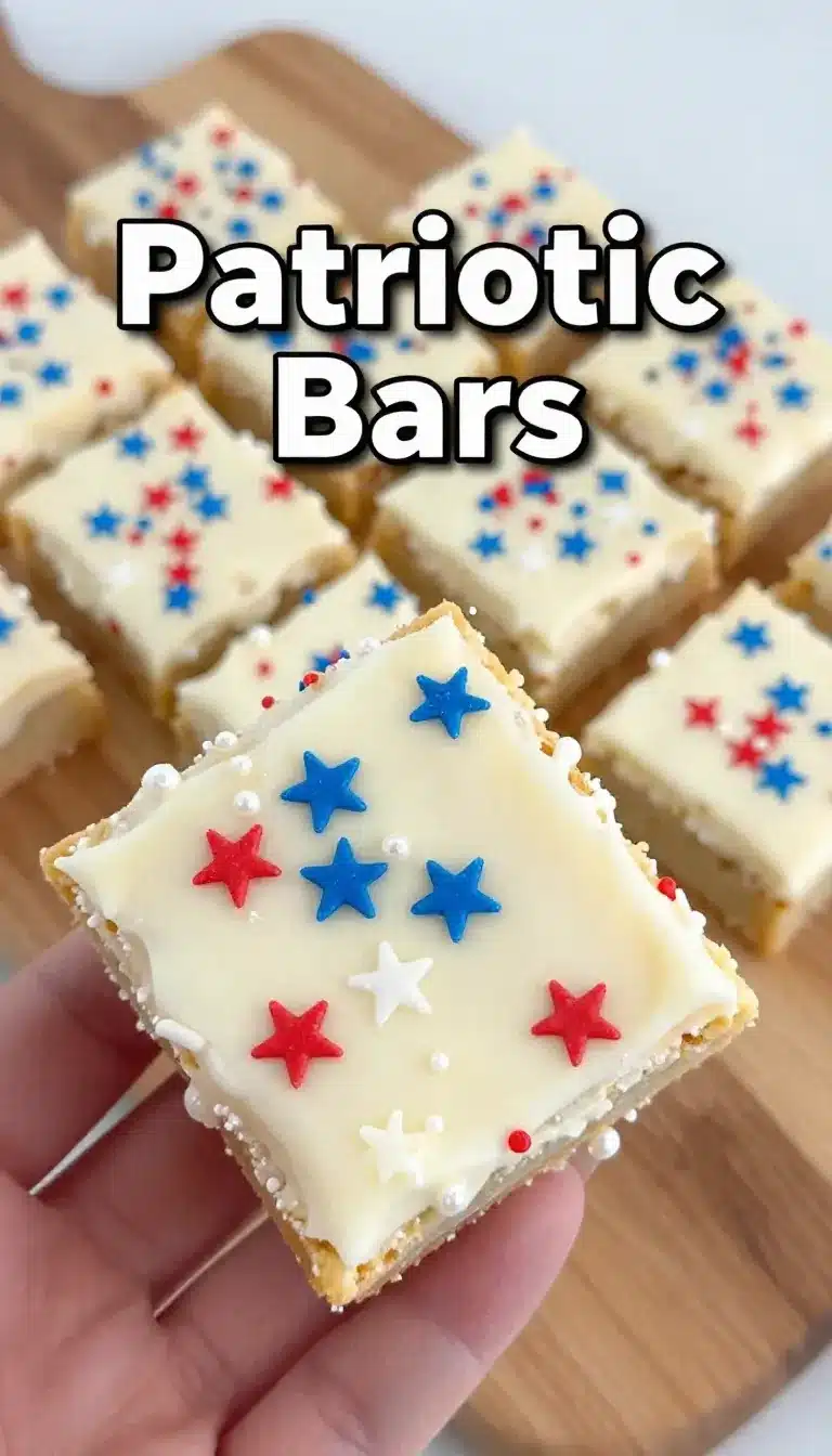 Patriotic Sugar Cookie Bars 10 A tray of patriotic sugar cookie bars topped with red, white, and blue frosting and sprinkles