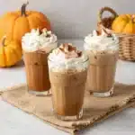Pumpkin Spice Latte of Starbucks 1 A Starbucks Pumpkin Spice Latte in a white cup topped with whipped cream and pumpkin spice seasoning.