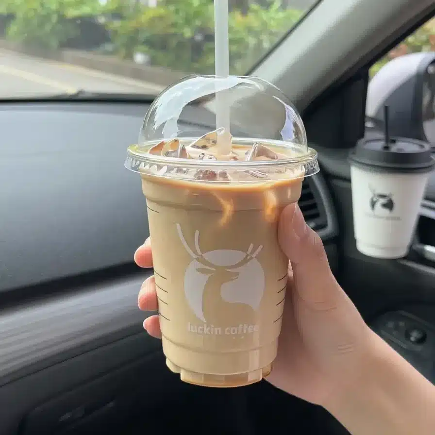 A creamy low calorie pumpkin white mocha topped with light foam and a sprinkle of cinnamon in a clear mug.